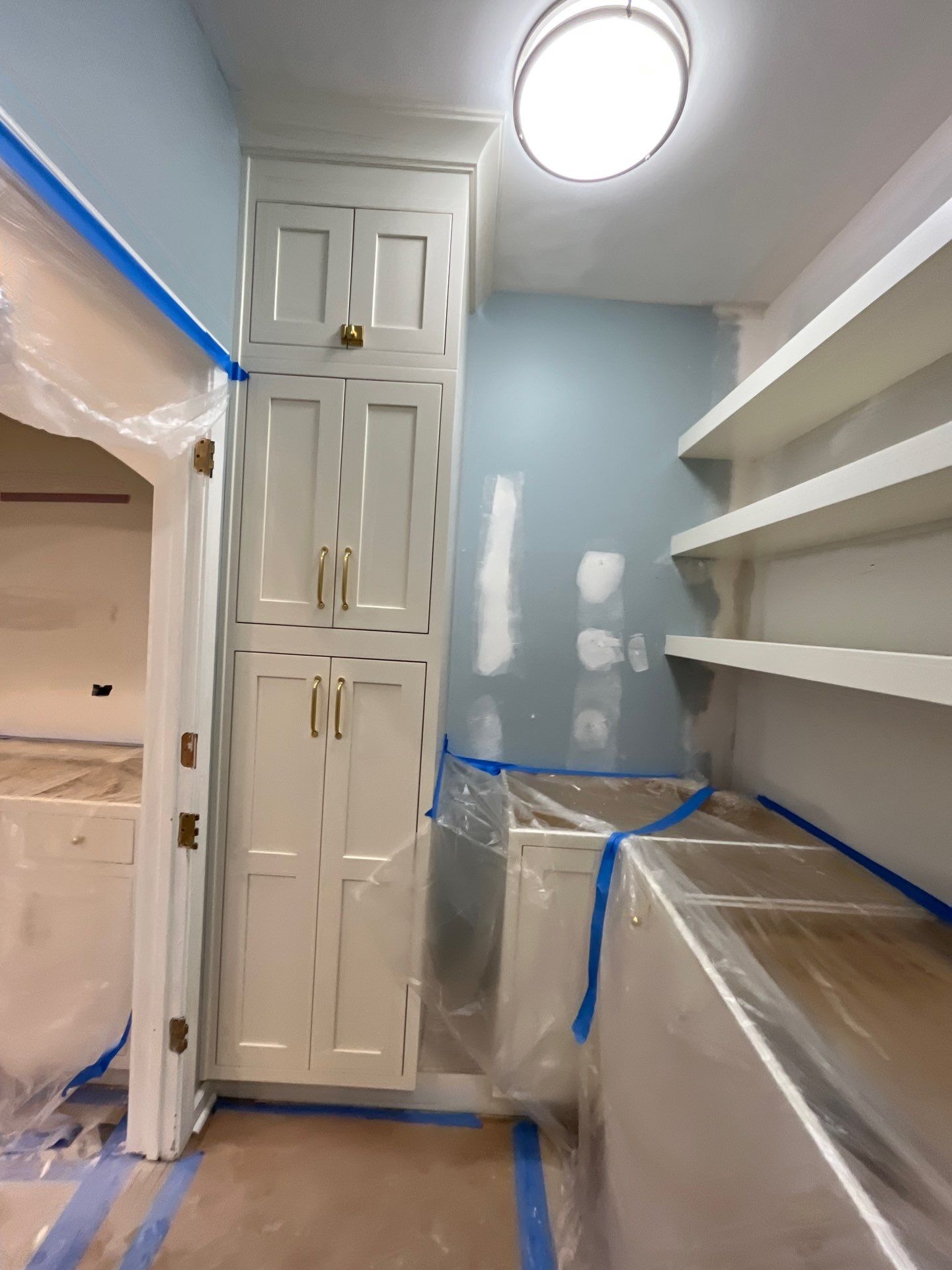 Pantry cabinet installation โ white shaker cabinets with gold hardware, open shelving built-in during kitchen renovation โ Powder Springs, GA, Estate Solutions