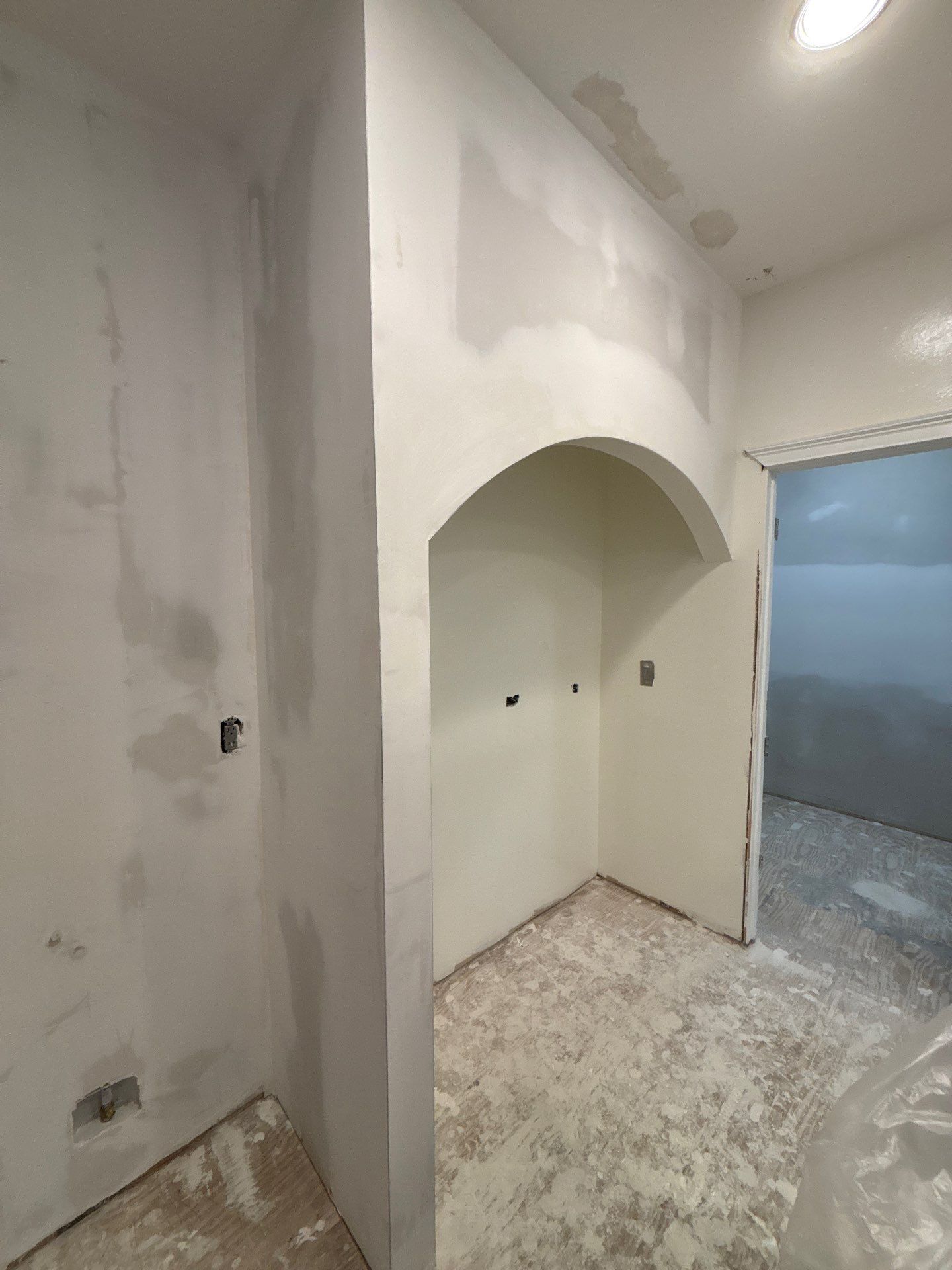 Drywall work in progress โ new arched niche framed and drywalled in kitchen area during renovation โ Powder Springs, GA, Estate Solutions